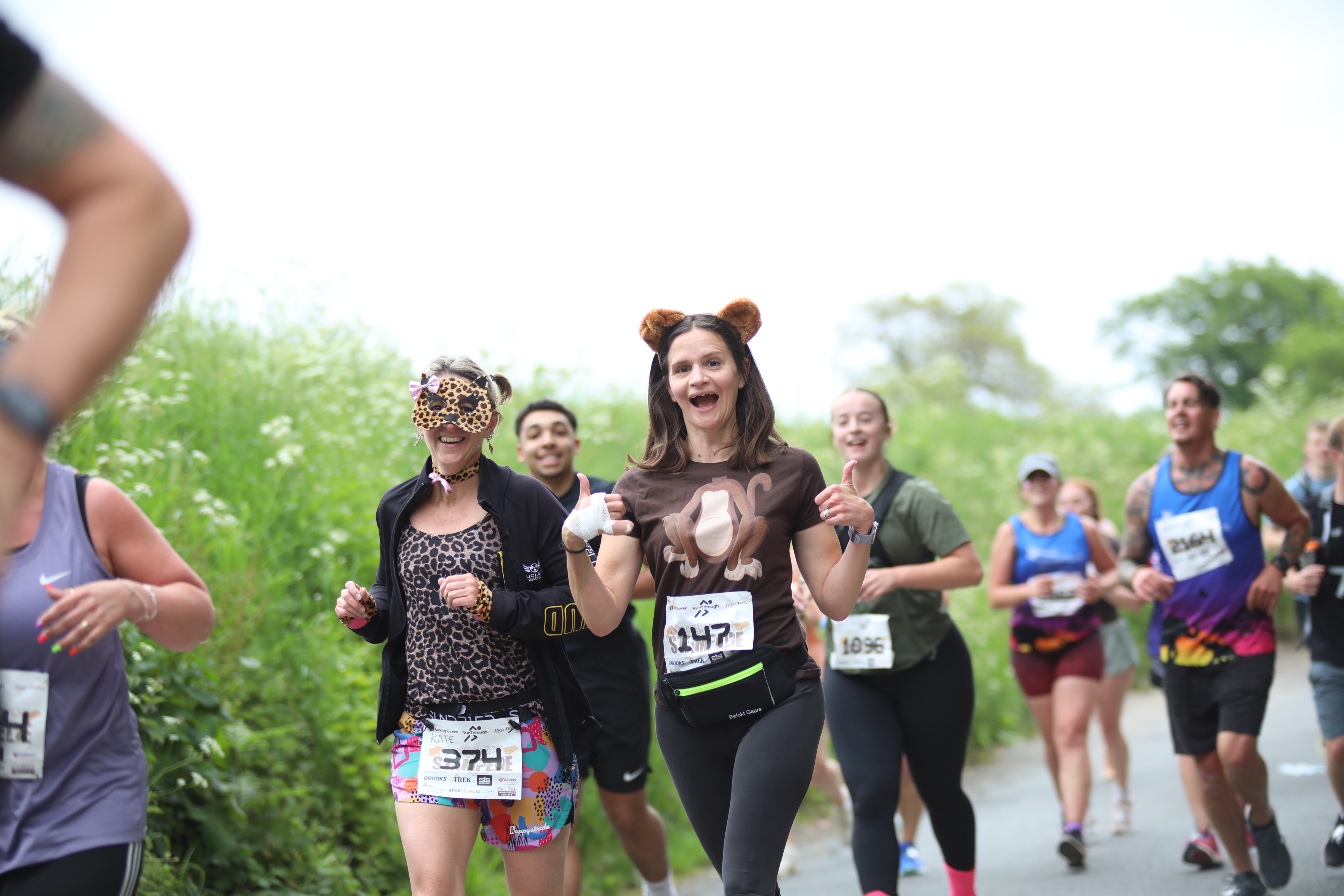 Runners in animal-themed outfits taking part in a RunThrough event, capturing the fun atmosphere ahead of the inaugural Flamingo Land 5K & 10K.