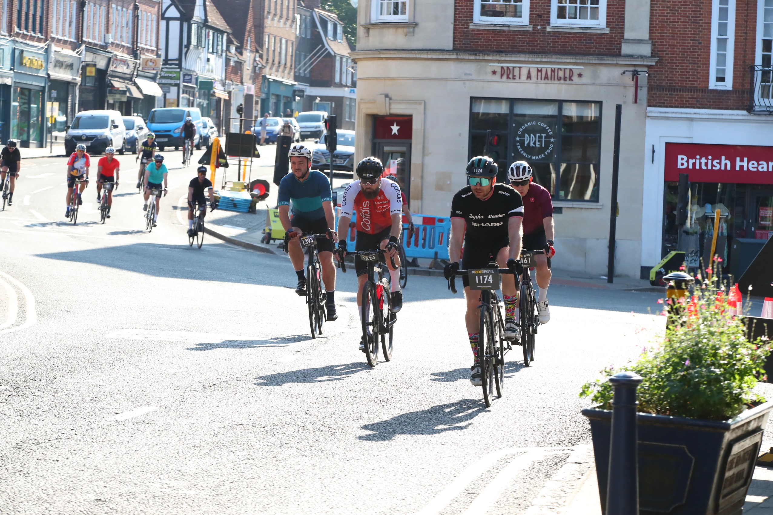 Cyclists taking part in Ride Reigate, riding through the town during the Surrey cycling sportive in support of The Brain Tumour Charity.